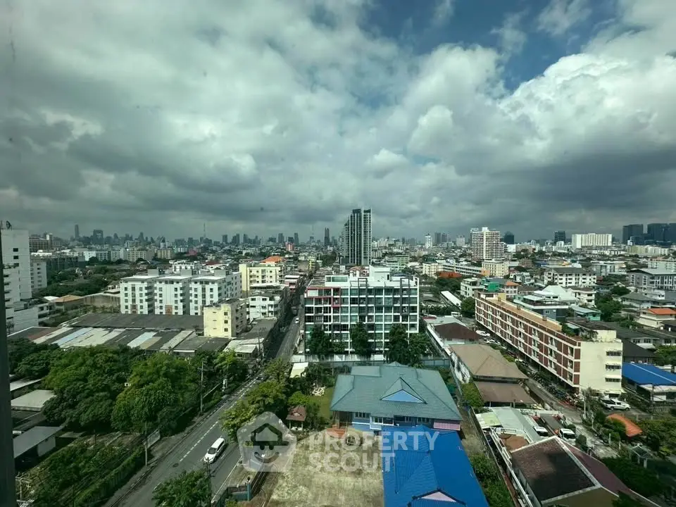 Stunning cityscape view from a high-rise building showcasing urban skyline and vibrant neighborhood.