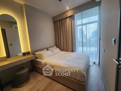 Modern bedroom with city view, featuring elegant decor and natural light through large windows.