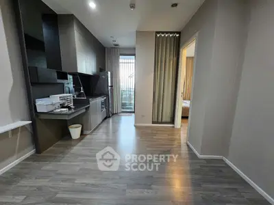 Modern open-layout kitchen with sleek design and spacious living area