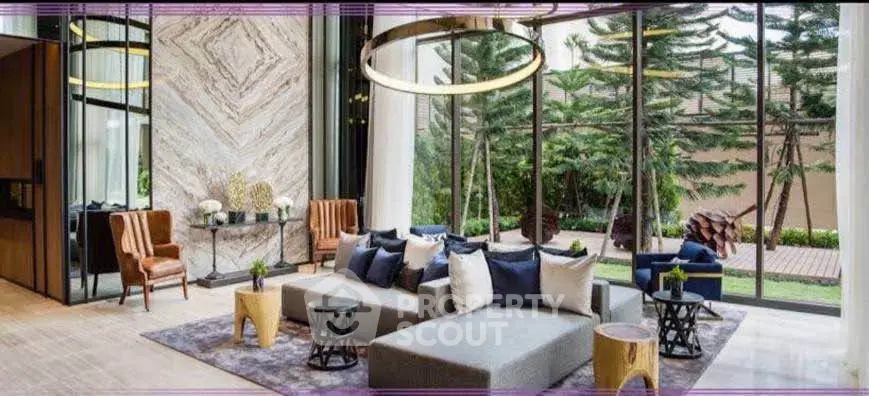 Luxurious modern living room with elegant decor and large windows overlooking lush greenery.