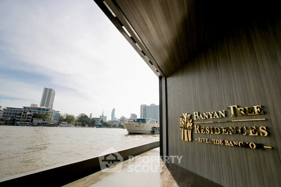 Luxurious riverside view from Banyan Tree Residences in Bangkok with modern architecture.