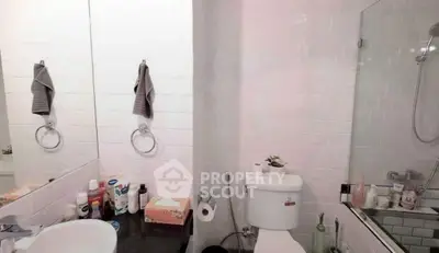 Charming bathroom with modern fixtures and ample storage space.