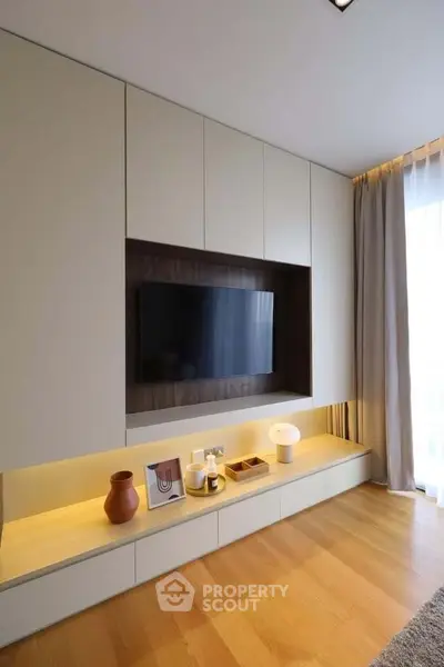 Modern living room with built-in TV unit and elegant decor