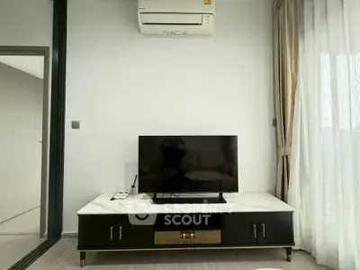 Modern living room with sleek TV stand and air conditioning unit