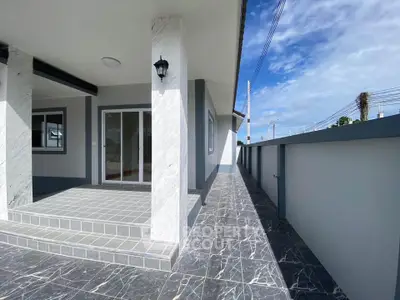 Modern exterior of a stylish home with marble tiles and sleek design