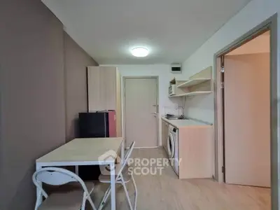 Cozy apartment interior with compact kitchen and dining area