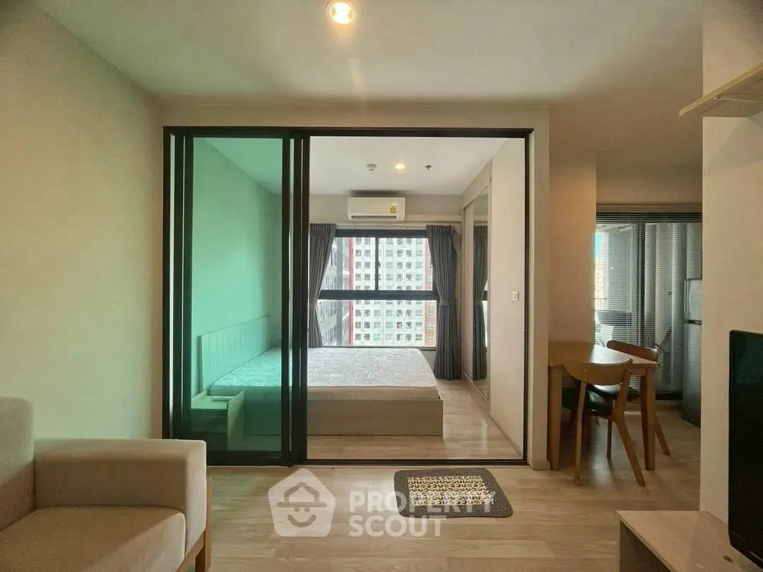 Modern apartment interior with glass partition and cozy furnishings