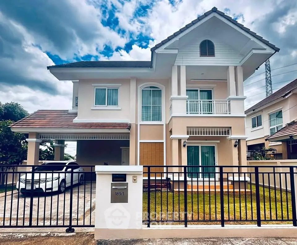 Elegant two-story house with a carport and manicured lawn in a serene neighborhood.