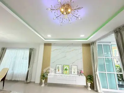 Elegant living room with modern chandelier and stylish decor