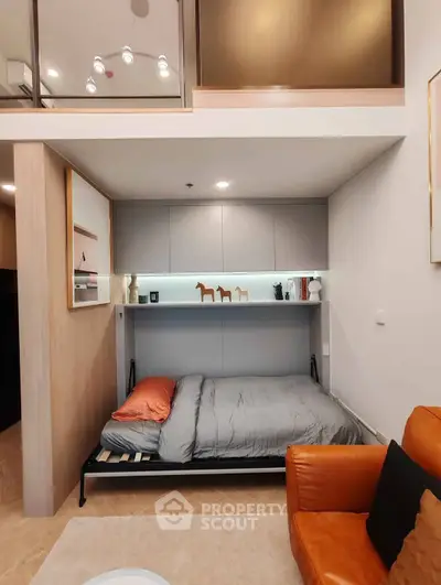 Modern studio apartment with loft bed and stylish decor