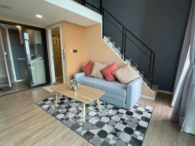 Modern duplex living room with stylish decor and cozy seating area