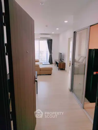 Modern apartment interior with open living room and balcony view