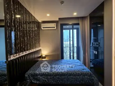 Modern bedroom with stylish decor and city view balcony in luxury apartment.