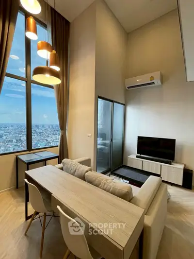 Modern living room with high ceiling and city view, featuring stylish lighting and cozy furniture.