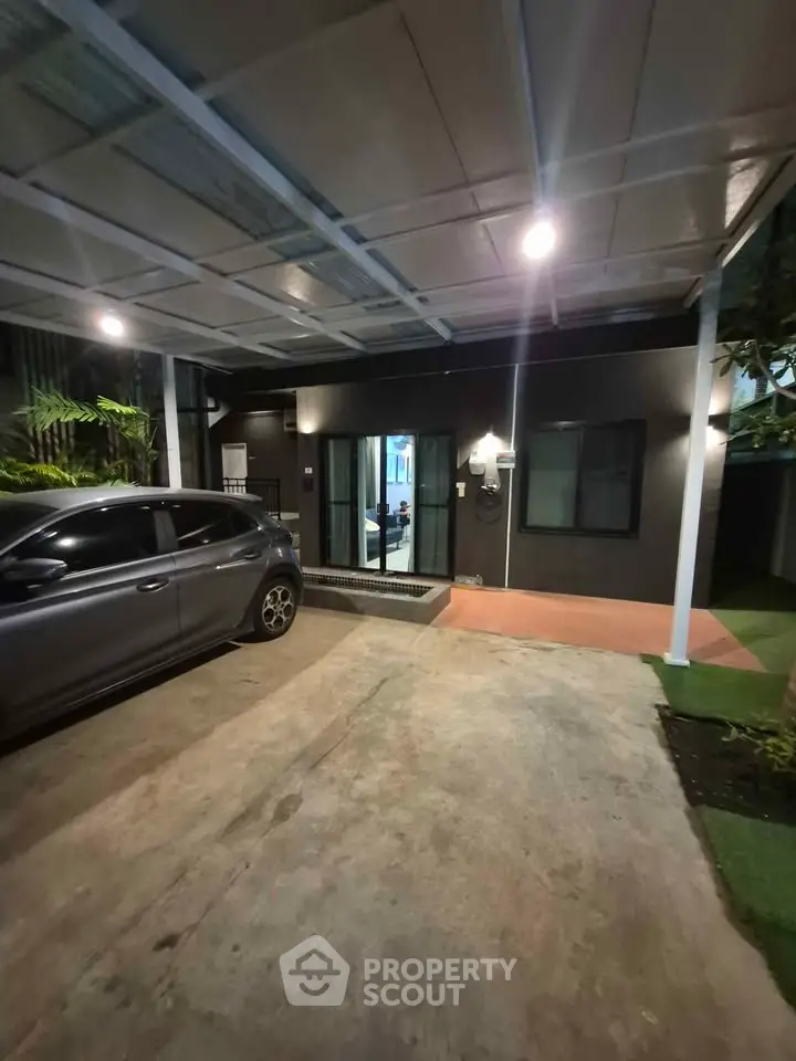 Modern home exterior with carport and sleek design, perfect for urban living.