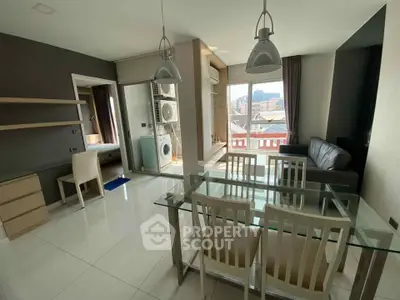 Modern living room with glass dining table and city view