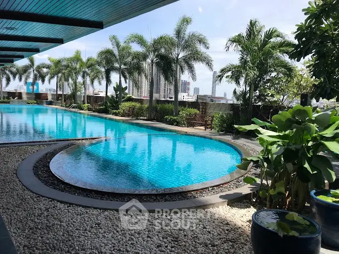 Luxurious rooftop pool with city skyline view and lush greenery