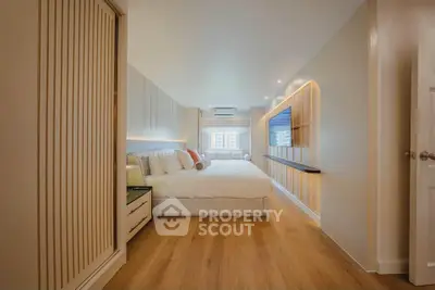 Spacious modern bedroom with elegant design and wooden flooring