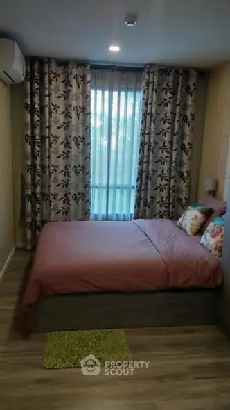 Cozy bedroom with floral curtains and modern decor