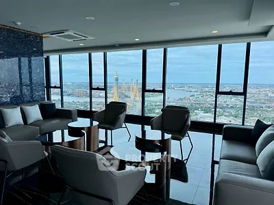 Luxurious high-rise living room with panoramic city and river views