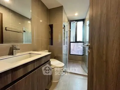 Modern bathroom with sleek design and city view from window