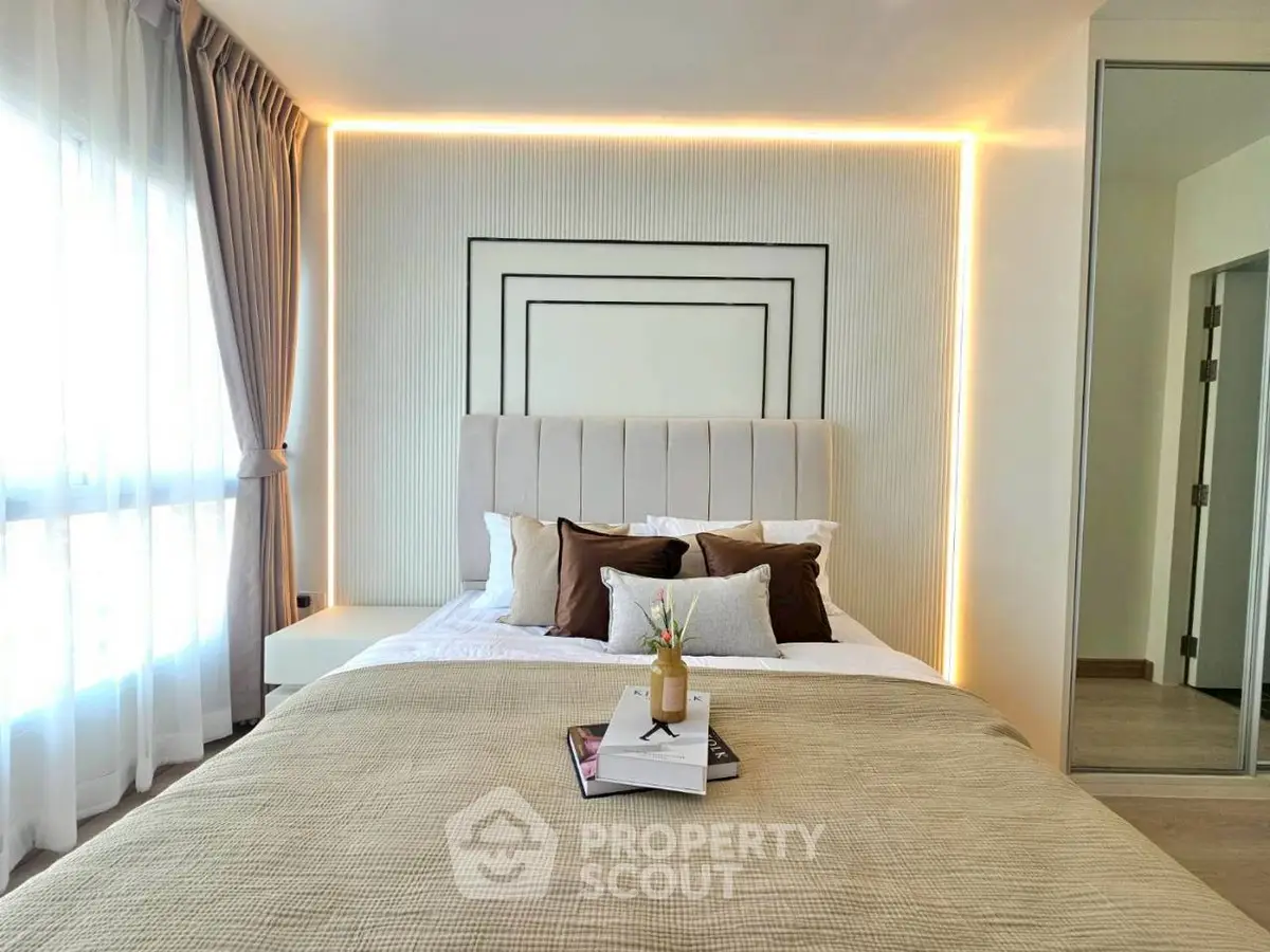 Luxurious bedroom with modern decor and ambient lighting, featuring a plush bed and elegant curtains.