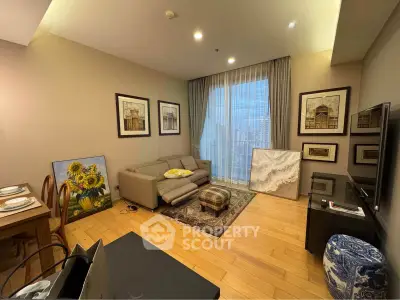Spacious living room with modern decor and city view, featuring elegant wooden flooring and stylish furniture.