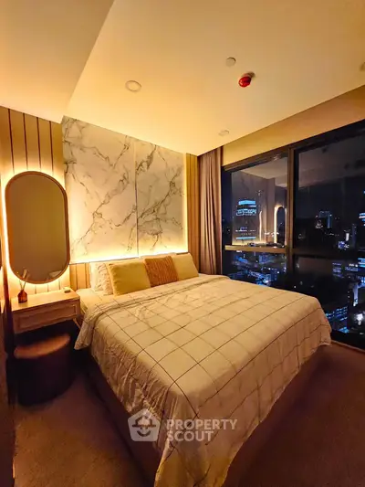 Luxurious bedroom with city view, elegant lighting, and modern decor