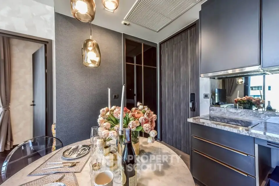 Elegant dining area with modern decor and stylish lighting