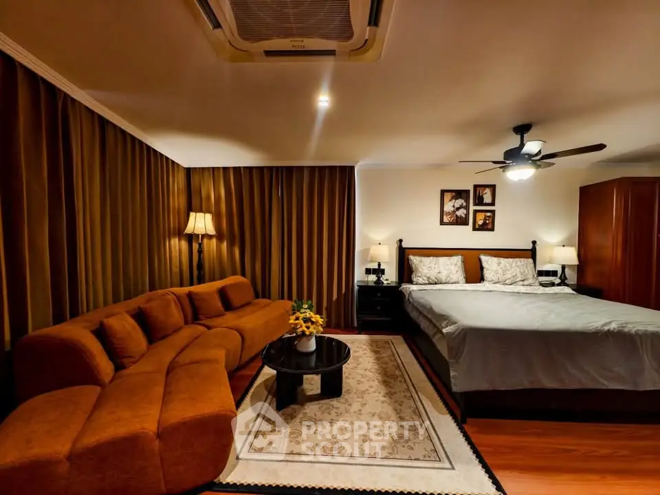 Luxurious bedroom with elegant decor and cozy seating area