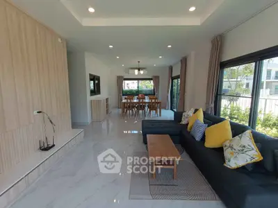Spacious modern living room with large windows and stylish decor
