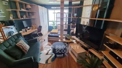 Stylish modern living room with integrated workspace and cozy decor