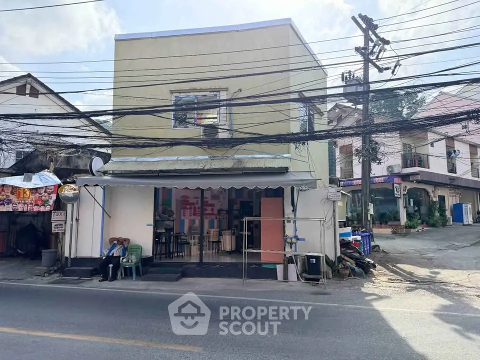 Charming street view of a small commercial building with potential for business opportunities.