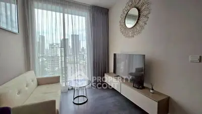 Modern living room with large window and city view, featuring stylish decor and contemporary furniture.