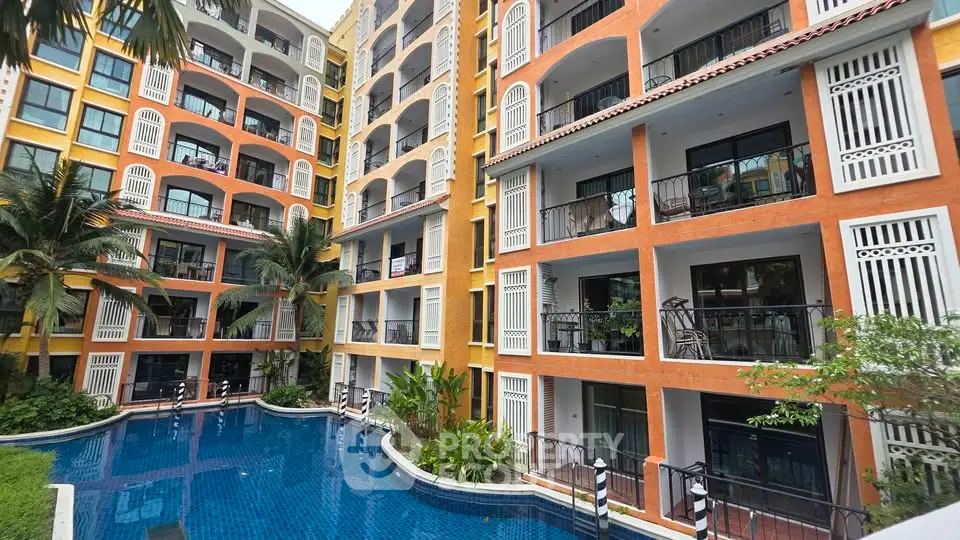 Stunning apartment complex with poolside view and vibrant architecture.