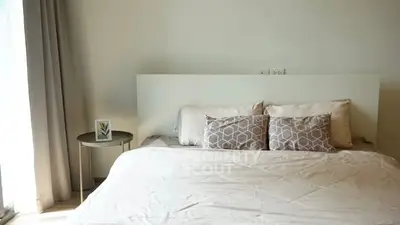 Modern bedroom with stylish decor and natural light