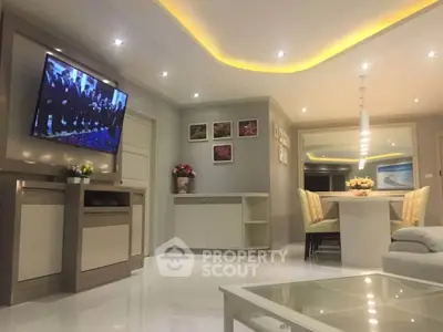 Modern living room with sleek design, recessed lighting, and elegant dining area, perfect for contemporary living.