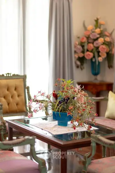 Elegant living room with vintage furniture and floral decor