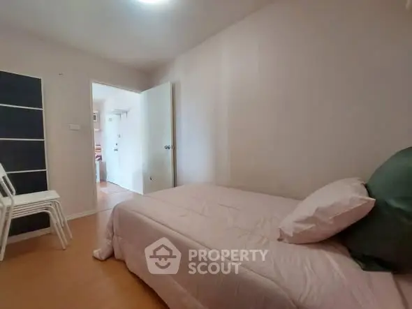 Cozy bedroom with single bed and minimalist decor