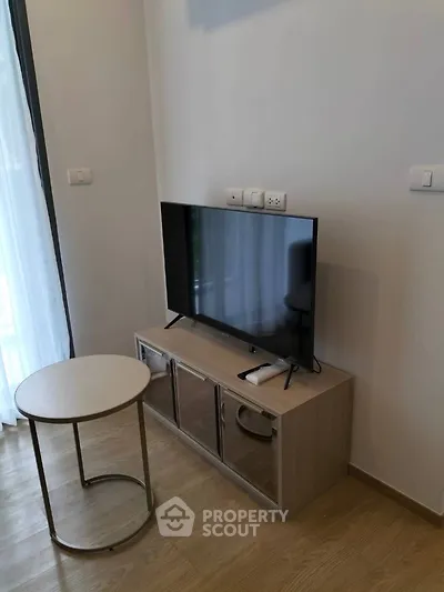 Modern living room with sleek TV setup and stylish furniture
