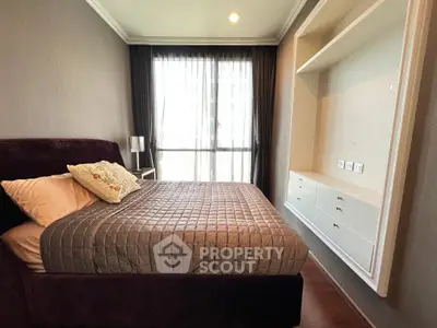 Luxurious bedroom with elegant decor and large window for natural light