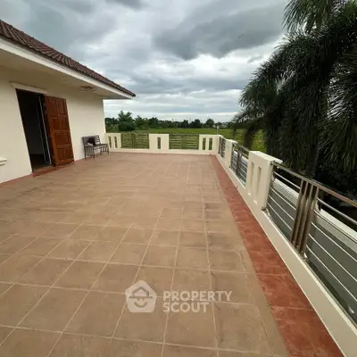 Spacious balcony with scenic views and lush greenery, perfect for relaxation and outdoor gatherings.