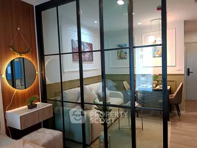 Modern living room with glass partition and stylish decor