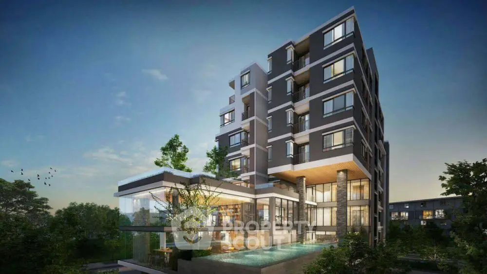 Modern luxury apartment building with pool and lush greenery at sunset