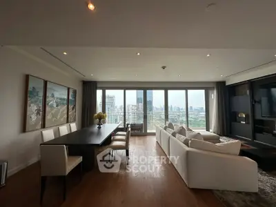 Luxurious living room with stunning city view and elegant dining area