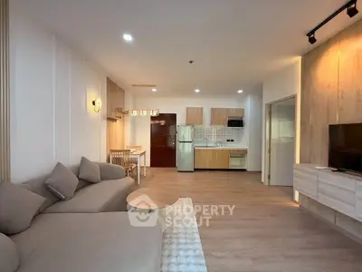 Spacious modern living room with open kitchen and stylish decor