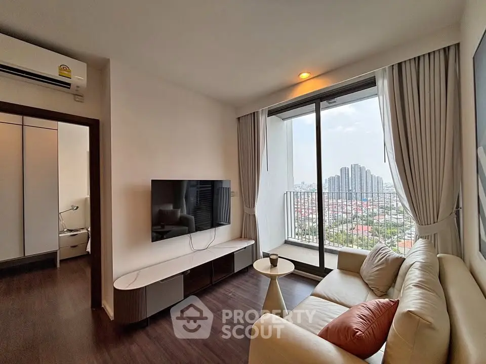 Modern living room with balcony view in high-rise apartment