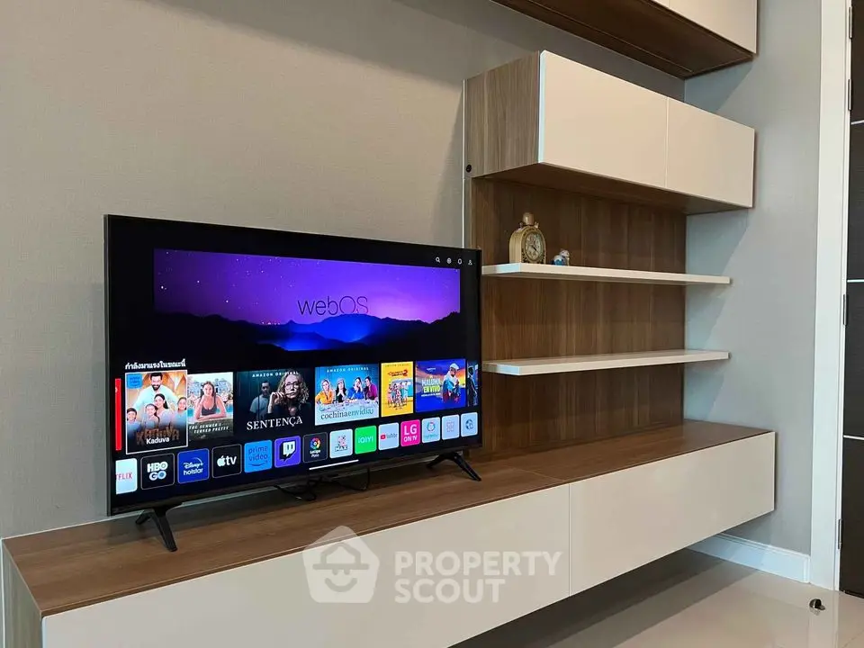 Modern living room with sleek TV unit and stylish shelving