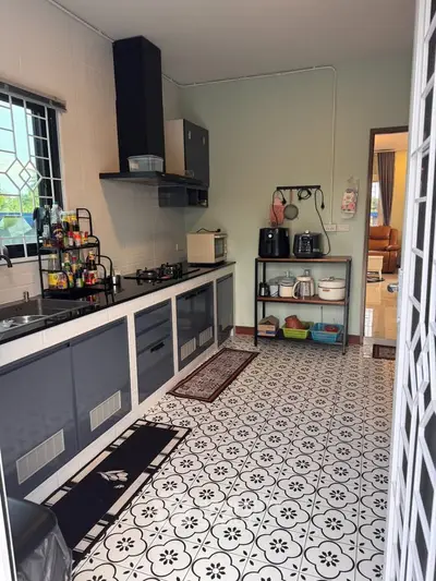 Charming kitchen with modern appliances and stylish tile flooring