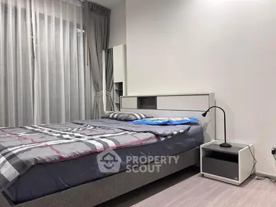 Modern bedroom with stylish decor and natural light